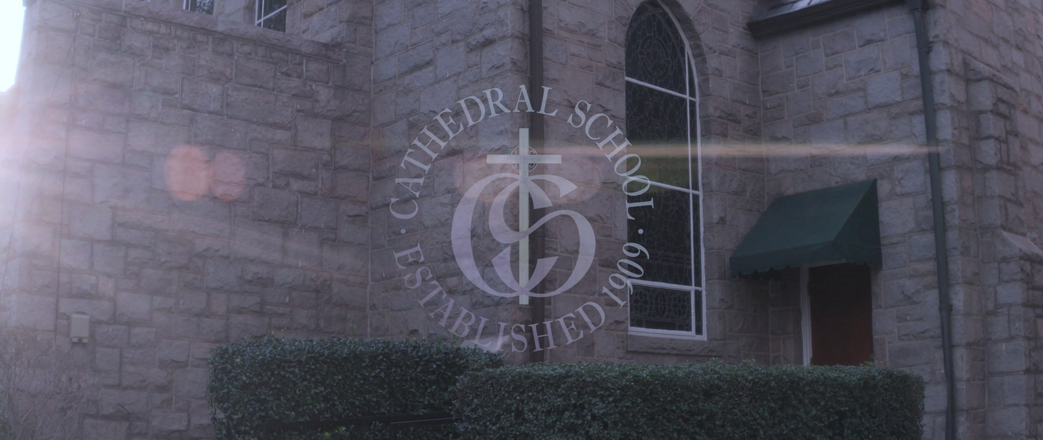 The gold cross on the historic Cathedral School church building