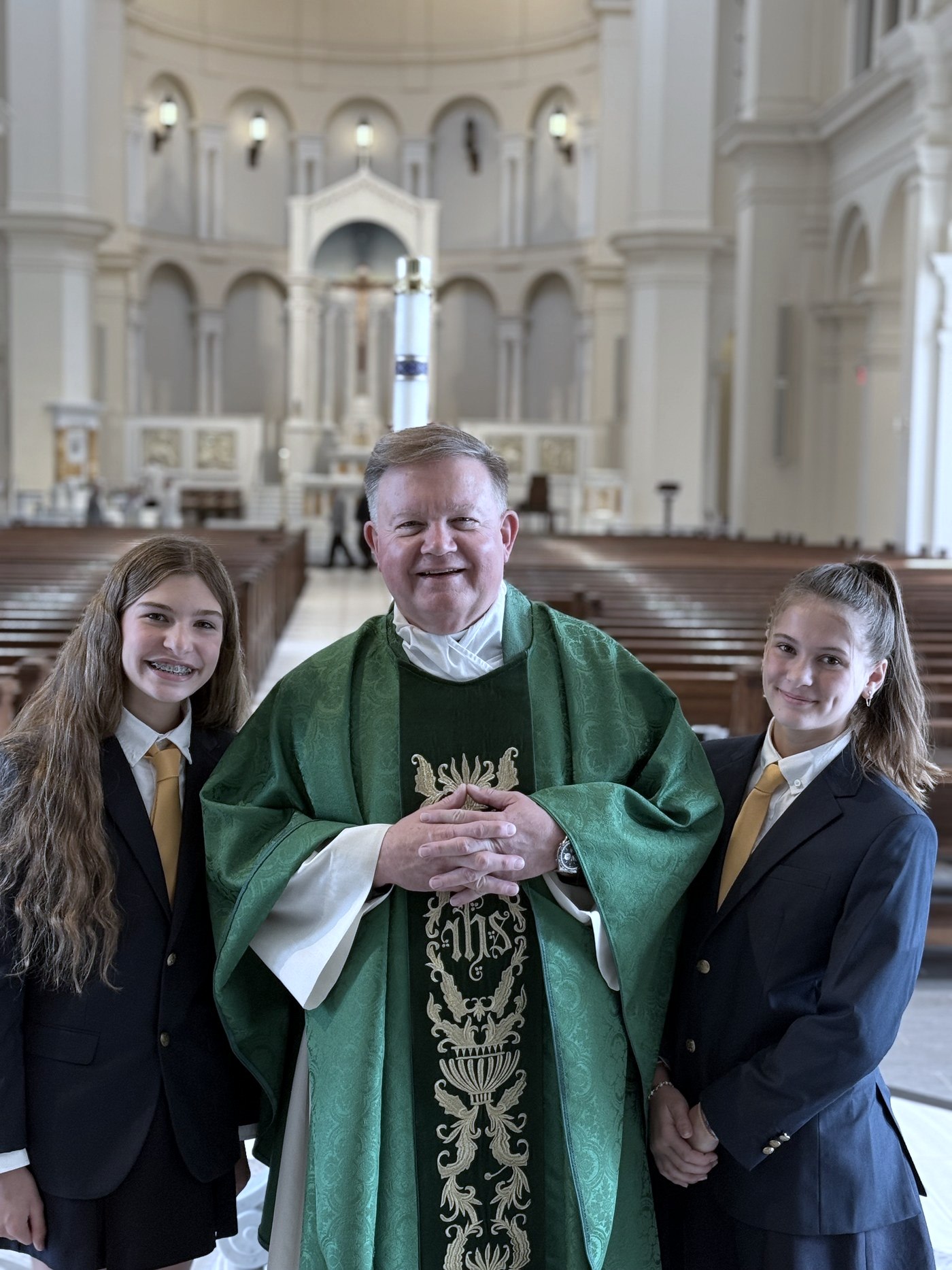Monsignor with Cathedral School students at Holy Name of Jesus Cathedral