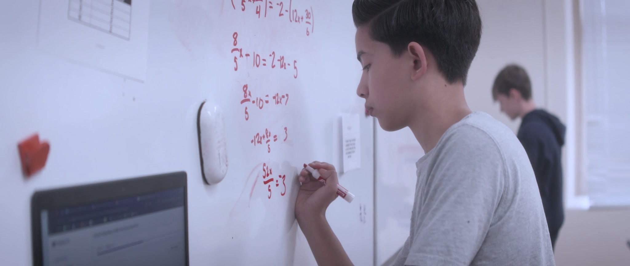 A Cathedral student working at the whiteboard
