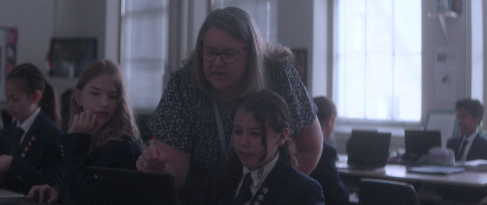 A Cathedral teacher working with students